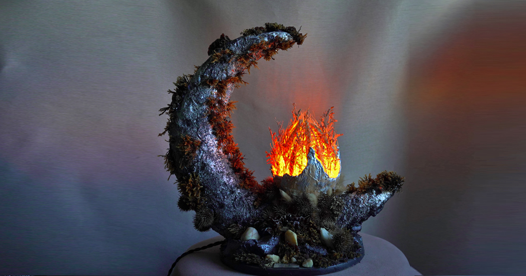 Handmade moon lamp with glowing fire center