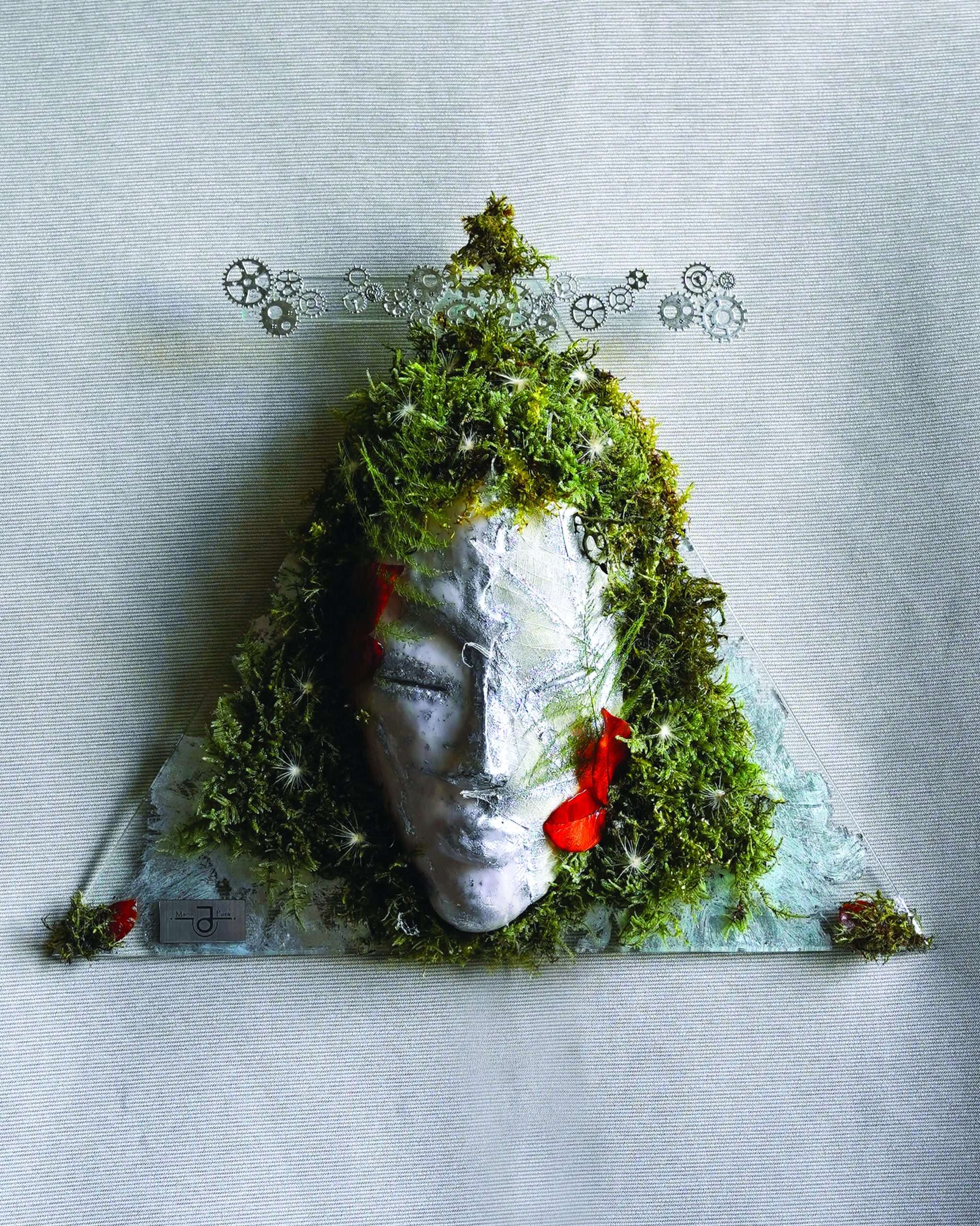 Handmade Gemini zodiac wall sculpture with moss and glass.